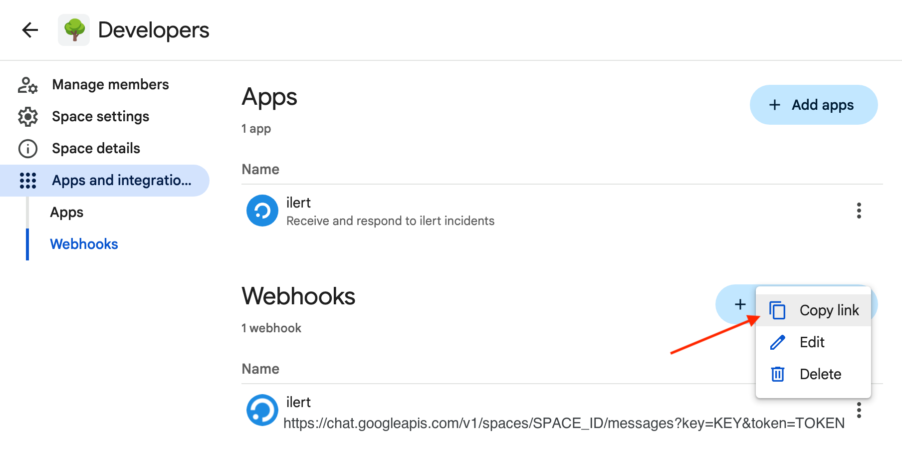 The Webhooks list showing one ilert webhook whose URL is shown here with SPACE_ID, KEY and TOKEN placeholders, with its overflow menu open on Copy link, Edit, and Delete.